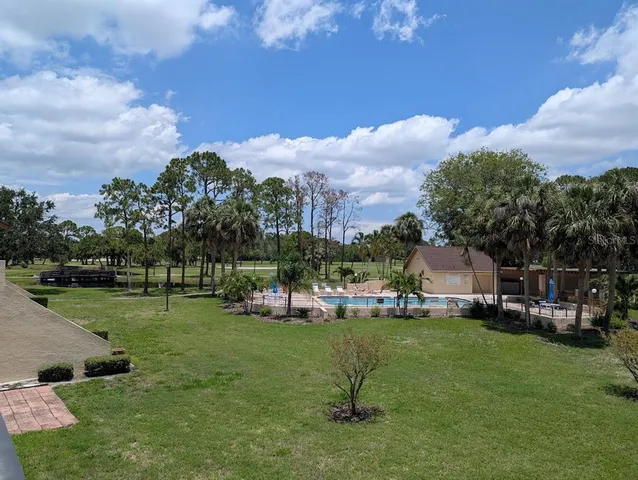 a view of a house with a backyard porch and sitting area