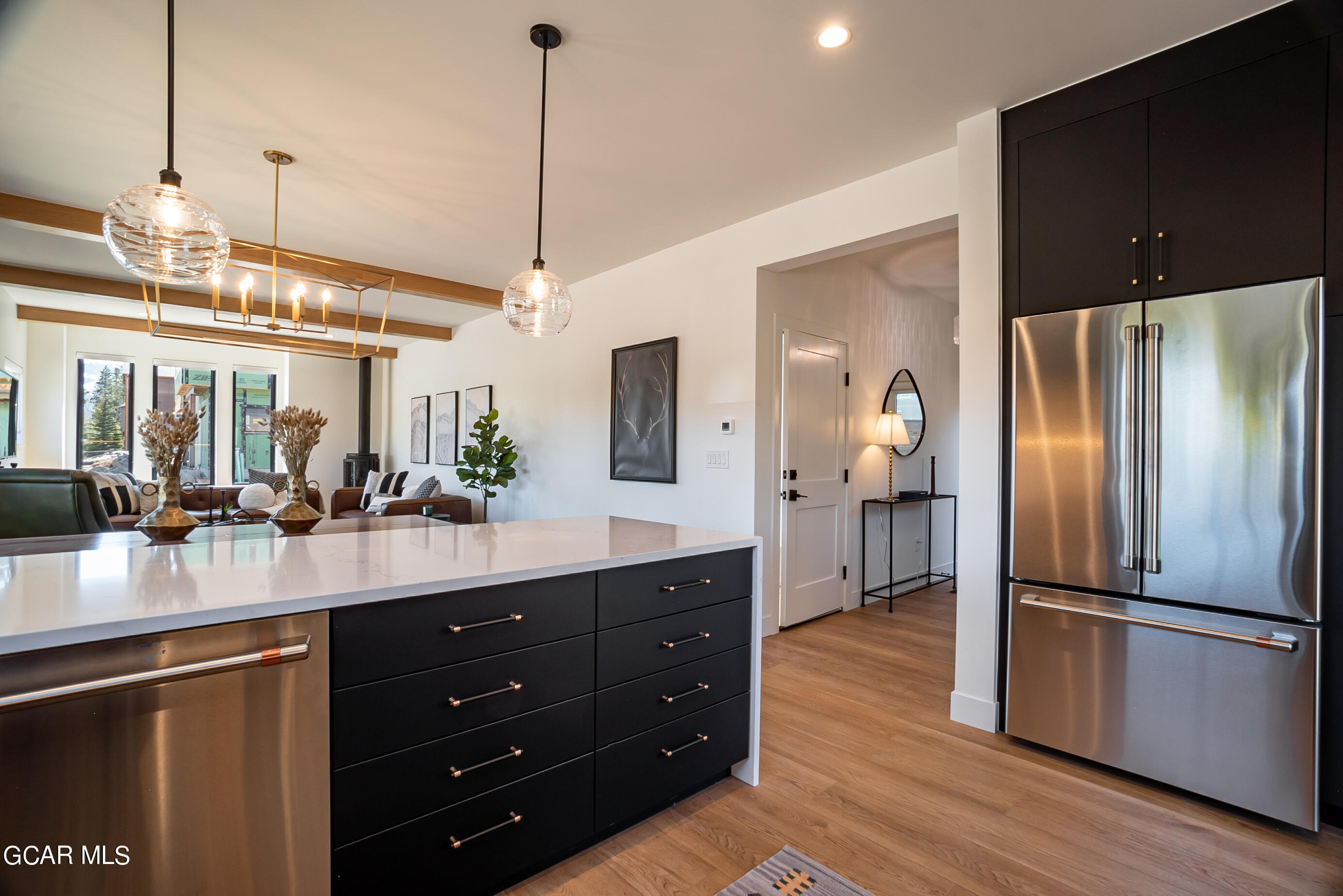 1066 Gcr 8 Tabernash, CO 80478 - Photo 13 of 46 a kitchen with stainless steel appliances a refrigerator a sink and wooden floor