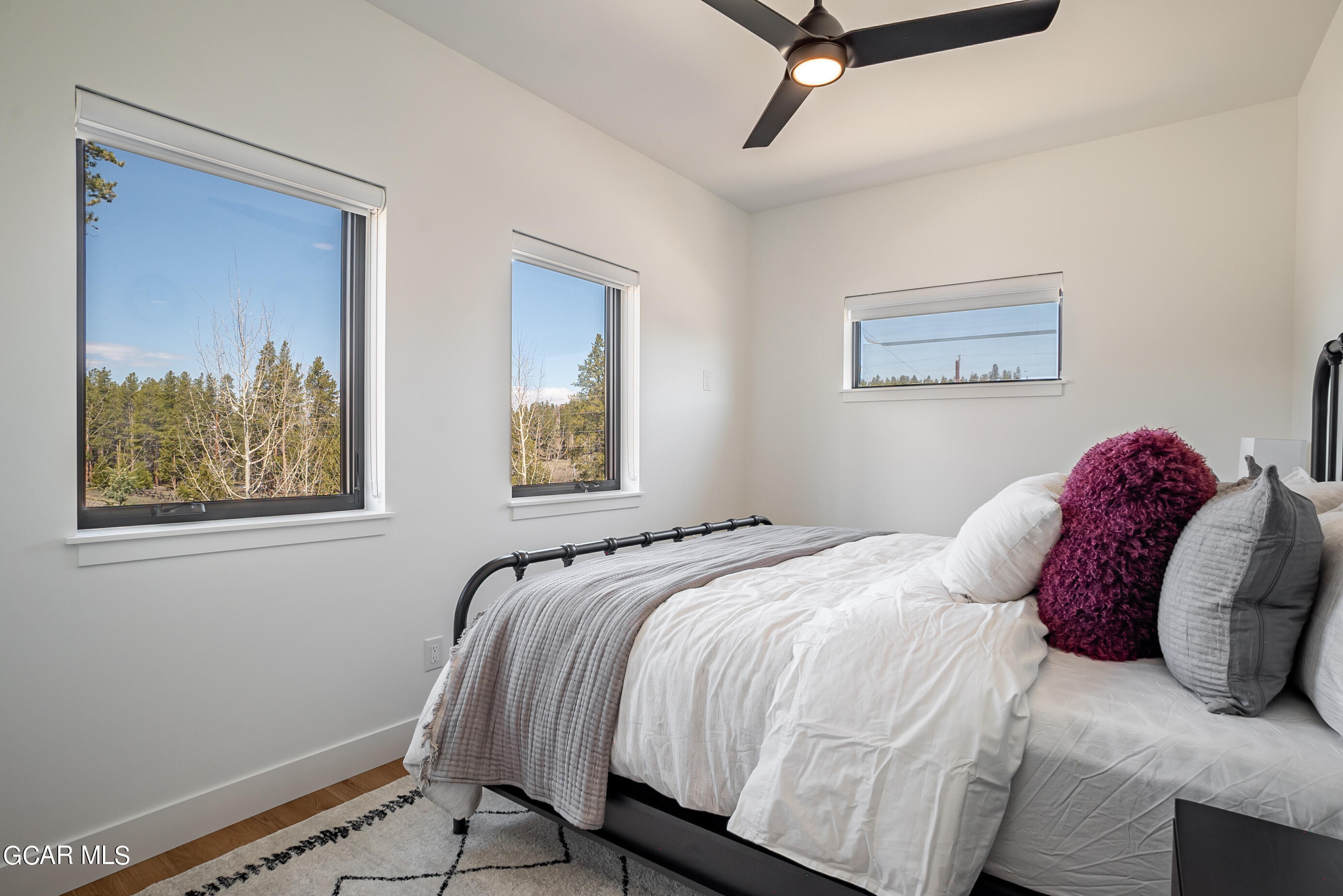 1066 Gcr 8 Tabernash, CO 80478 - Photo 22 of 46 a bedroom with a bed and the painting on the wall