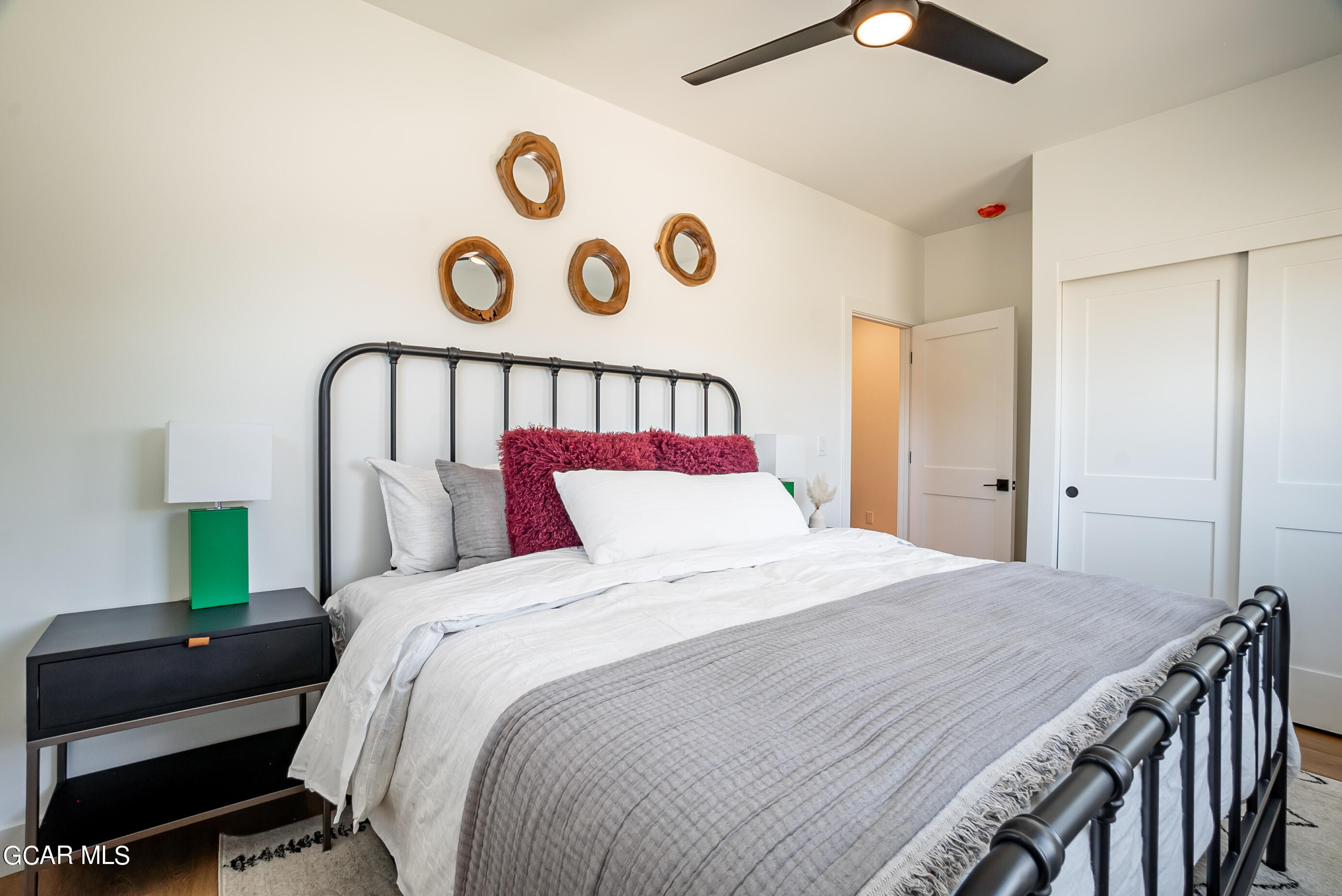 1066 Gcr 8 Tabernash, CO 80478 - Photo 23 of 46 a bedroom with a bed and a lamp on a table