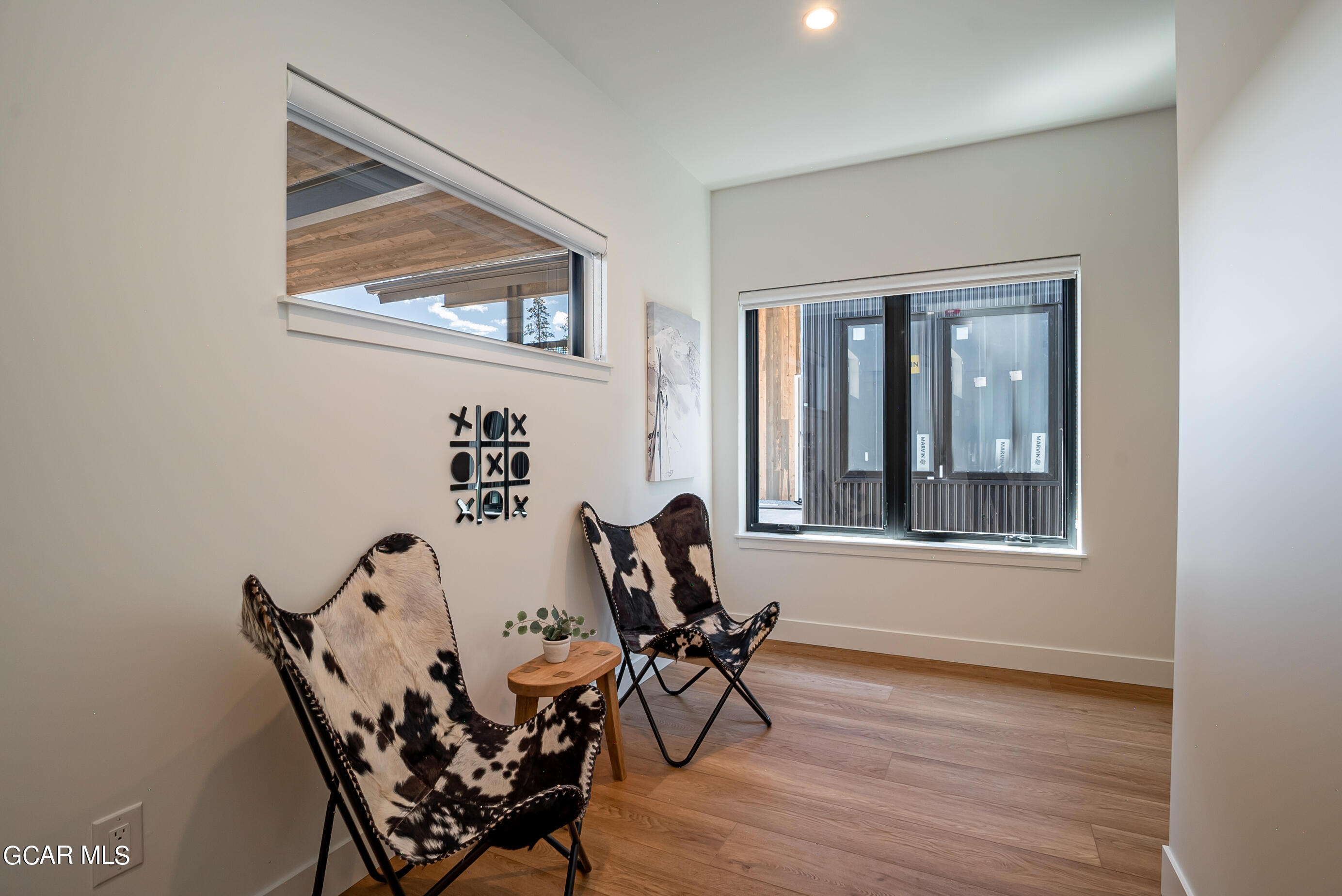 1066 Gcr 8 Tabernash, CO 80478 - Photo 26 of 46 a view of a dining room with furniture and wooden floor