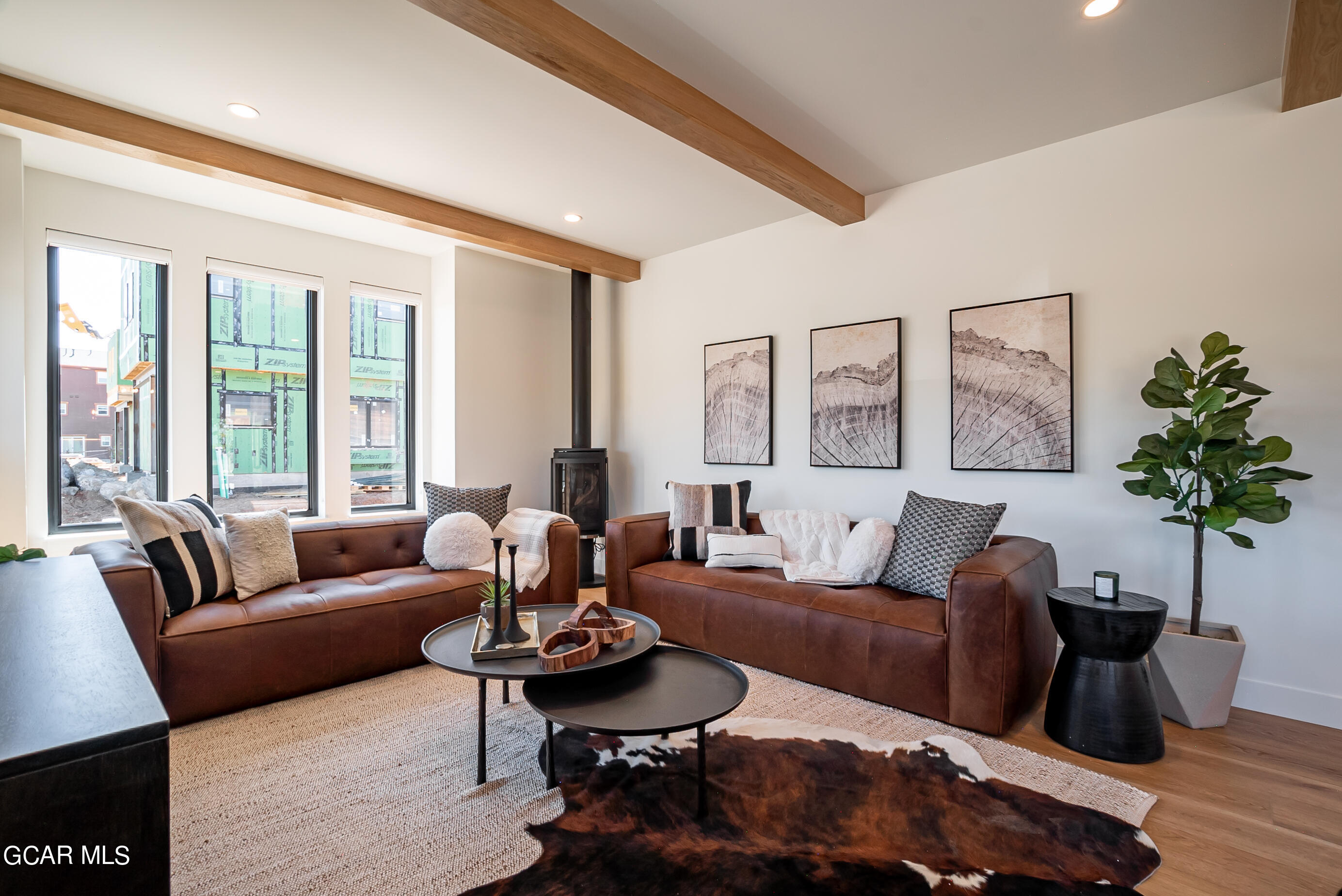 1066 Gcr 8 Tabernash, CO 80478 - Photo 4 of 46 a living room with furniture potted plant and a large window