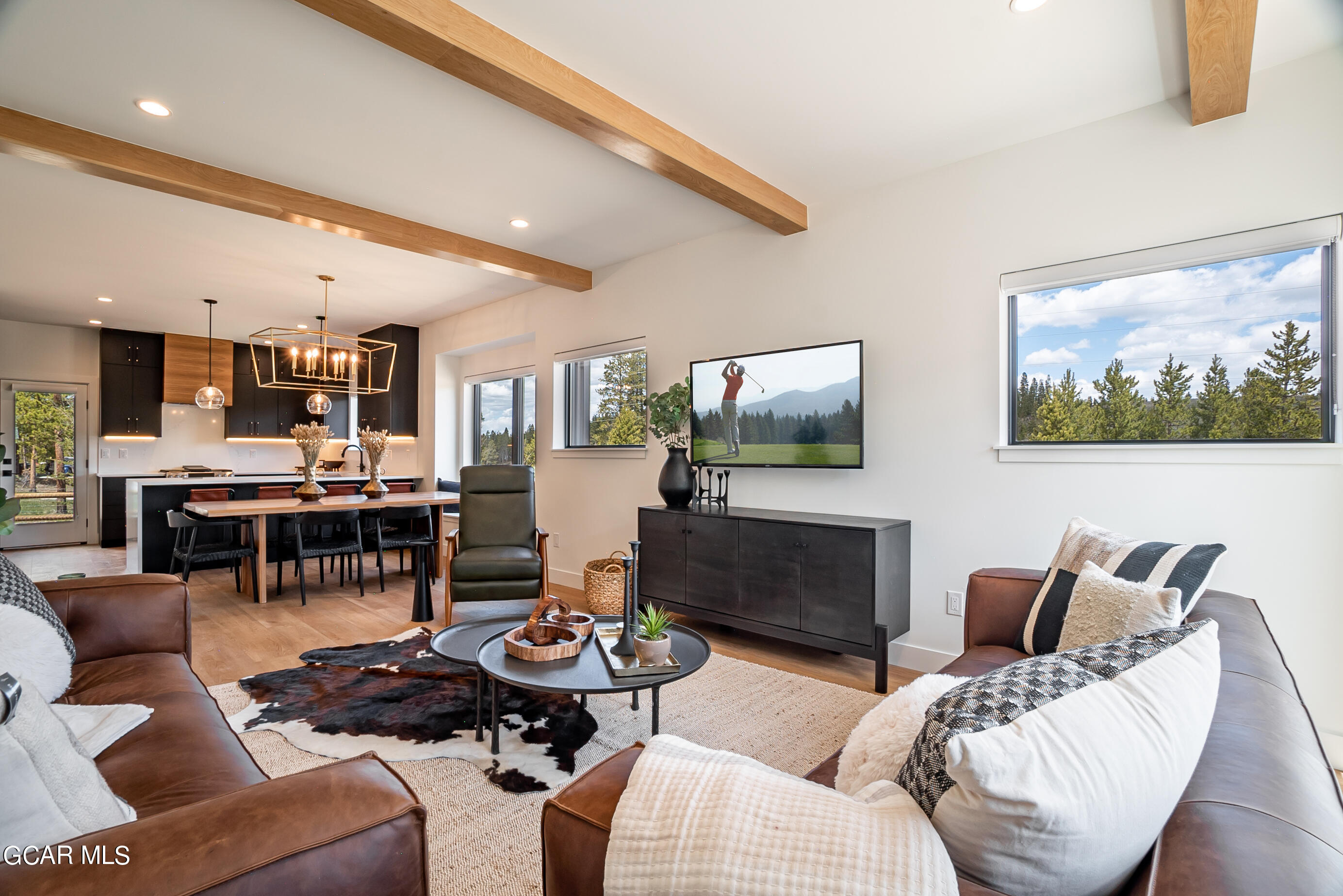 1066 Gcr 8 Tabernash, CO 80478 - Photo 6 of 46 a living room with furniture and a flat screen tv