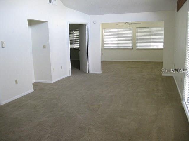 11450 Harbor Way, Unit 5002 Largo, FL 33774 - Photo 6 of 25 an empty room with windows