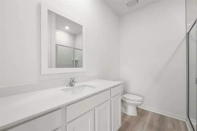 a bathroom with a sink toilet and vanity