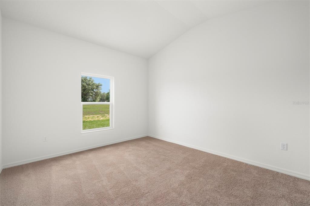13303 Tula Loop Astatula, FL 34705 - Photo 10 of 18 an empty room with a window