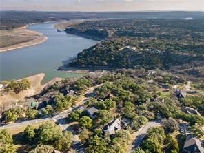 334 Coventry Road Spicewood, TX 78669 - Photo 1 of 1 a view of a lake in a field
