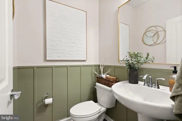 a room with furniture and a potted plant