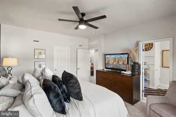 a spacious bathroom with a double vanity sink and a mirror