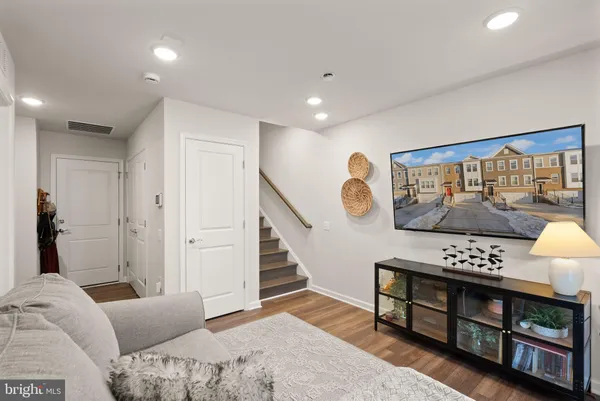 a living room with furniture and a gate