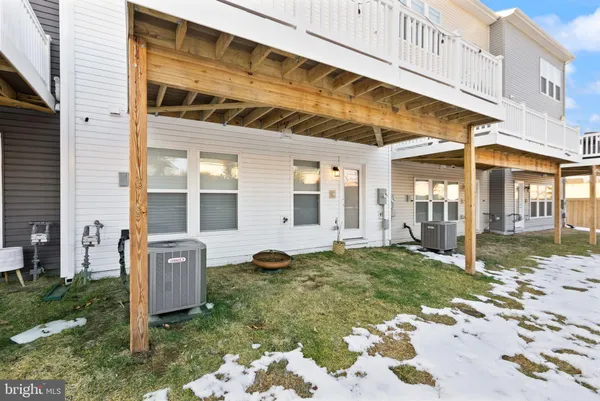 a front view of a building with a yard