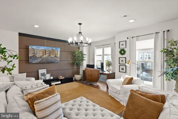 a spacious bedroom with a bed and a couch