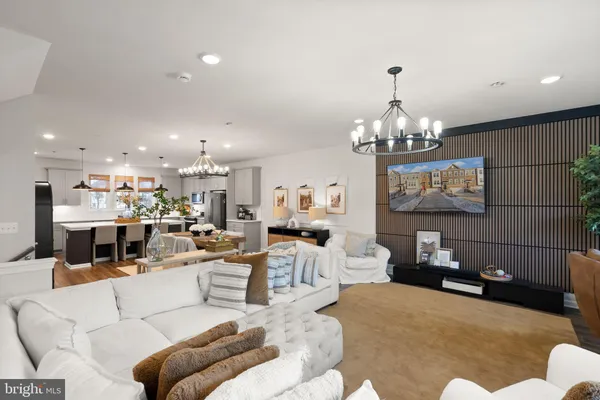 a large kitchen with a table and chairs