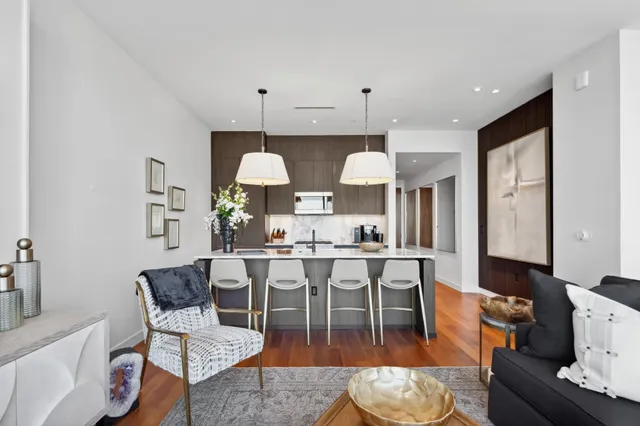 a view of kitchen with cabinets table and chairs