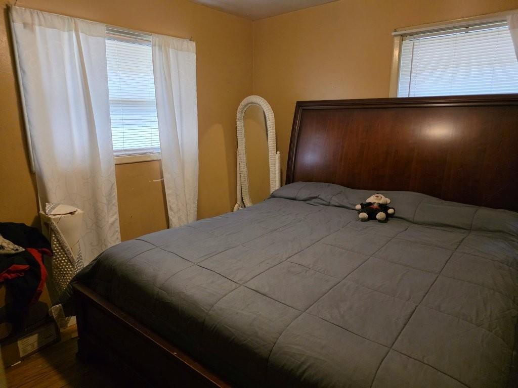 1882 Glen Echo Drive Decatur, GA 30032 - Photo 13 of 24 a bedroom with a bed and a mirror