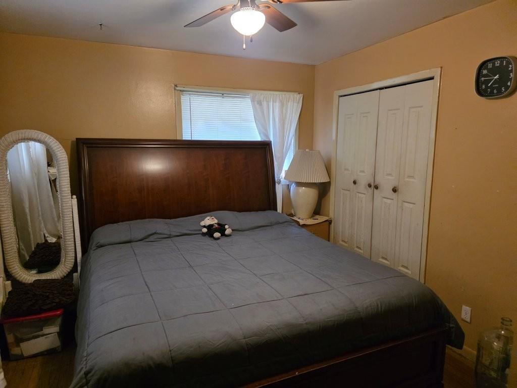 1882 Glen Echo Drive Decatur, GA 30032 - Photo 15 of 24 a bedroom with a bed and a chandelier