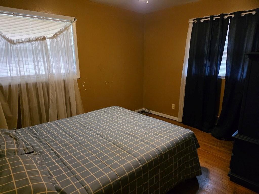1882 Glen Echo Drive Decatur, GA 30032 - Photo 16 of 24 a bedroom with a bed and a mirror