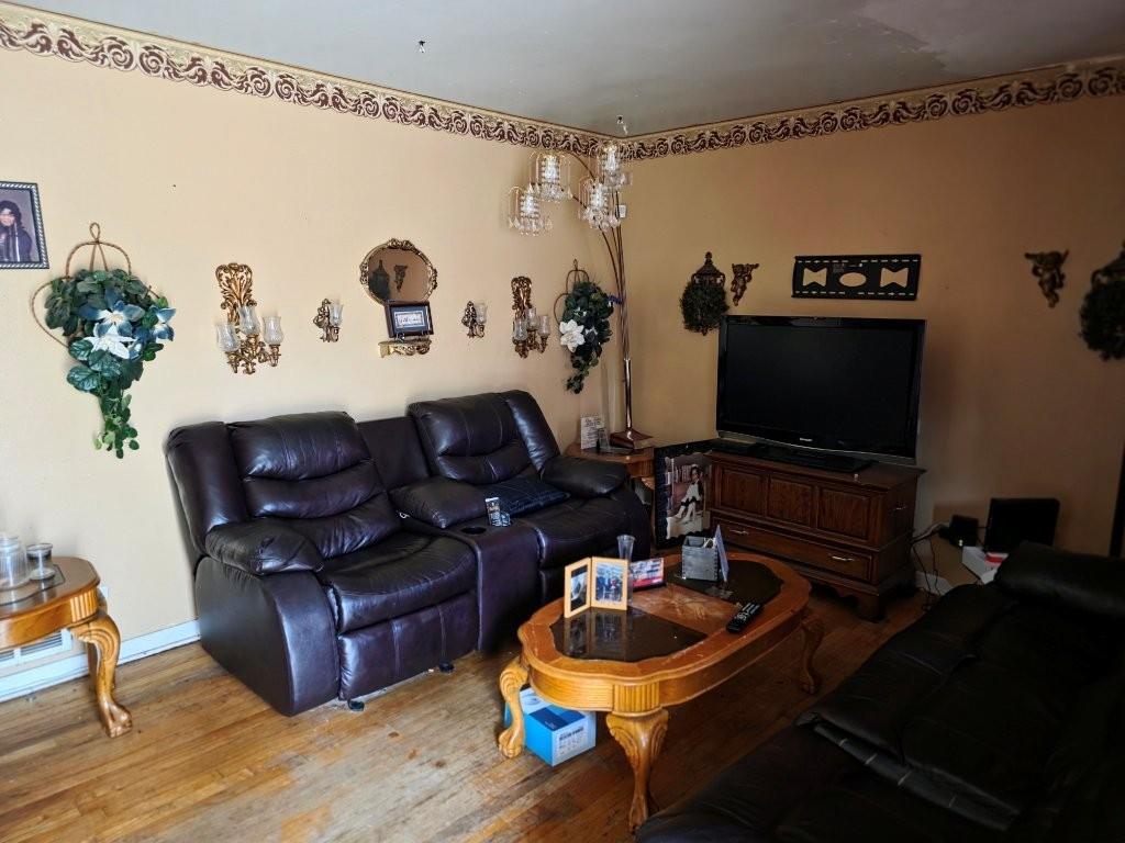 1882 Glen Echo Drive Decatur, GA 30032 - Photo 3 of 24 a living room with furniture and a flat screen tv