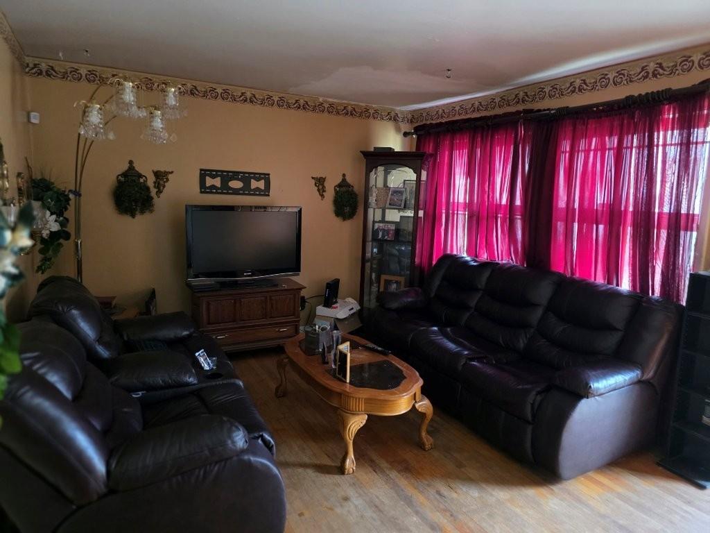 1882 Glen Echo Drive Decatur, GA 30032 - Photo 4 of 24 a living room with furniture and a flat screen tv