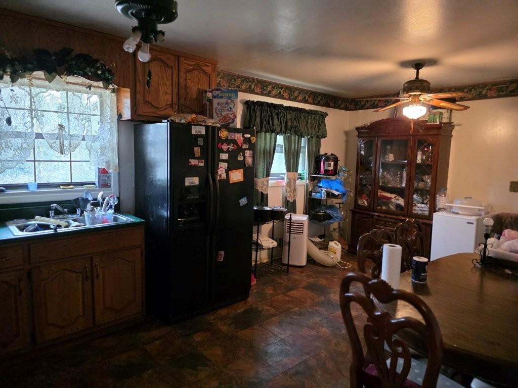 1882 Glen Echo Drive Decatur, GA 30032 - Photo 7 of 24 a kitchen with refrigerator and chairs