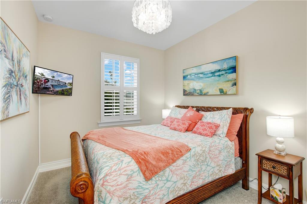 846 Enbrook Loop Naples, FL 34114 - Photo 12 of 45 a bedroom with a bed and a wall painting