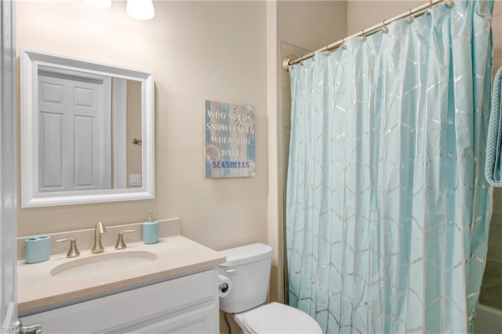 846 Enbrook Loop Naples, FL 34114 - Photo 13 of 45 a bathroom with a sink a toilet and shower