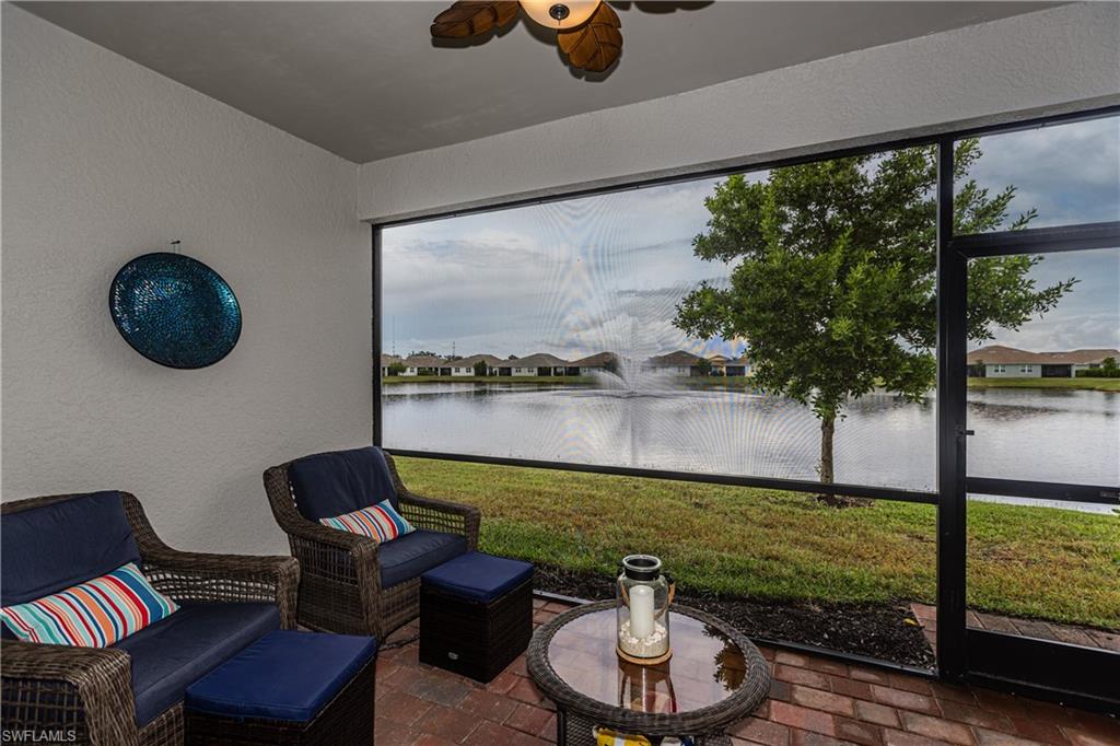 846 Enbrook Loop Naples, FL 34114 - Photo 15 of 45 a view of a porch with furniture and a yard