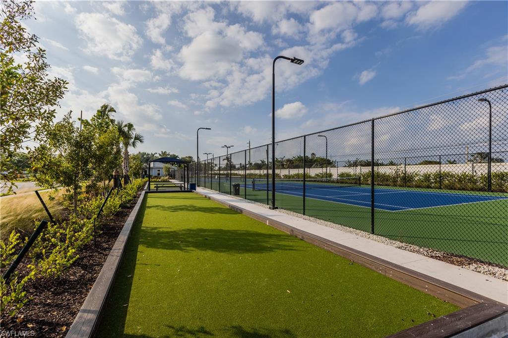 846 Enbrook Loop Naples, FL 34114 - Photo 21 of 45 a view of a swimming pool with a chair