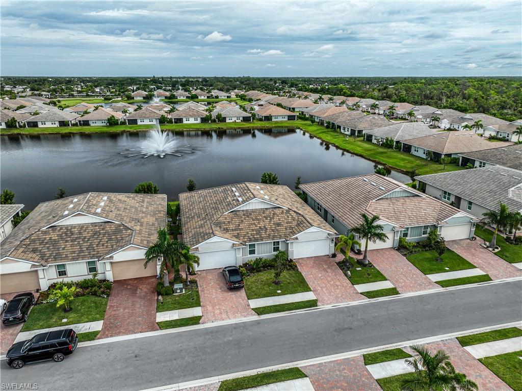 846 Enbrook Loop Naples, FL 34114 - Photo 34 of 45 an aerial view of a house with a lake view