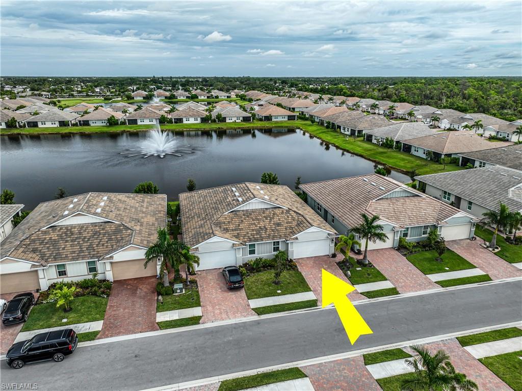 846 Enbrook Loop Naples, FL 34114 - Photo 35 of 45 an aerial view of a house with a lake view