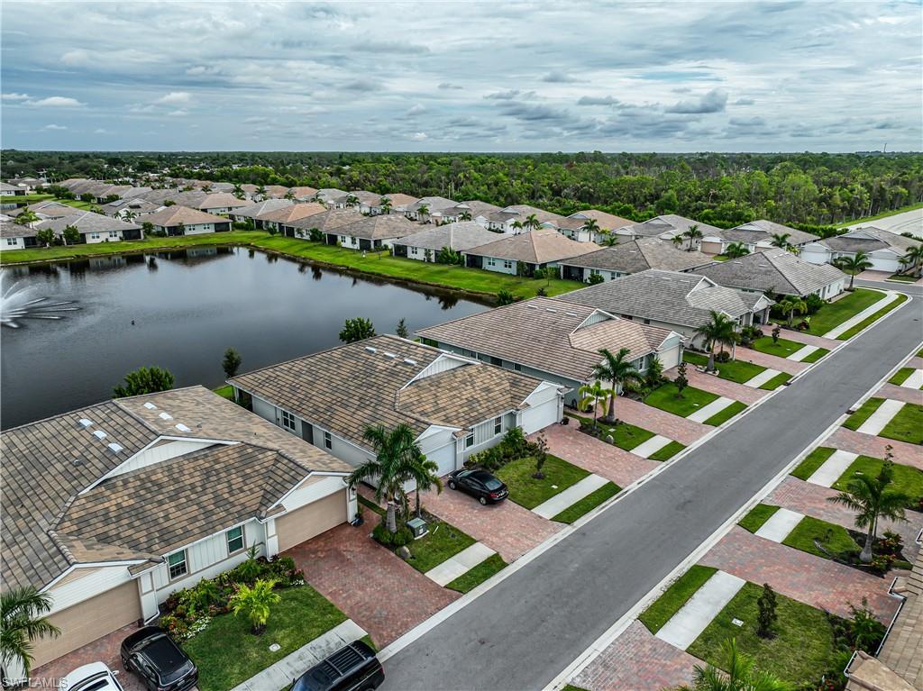 846 Enbrook Loop Naples, FL 34114 - Photo 36 of 45 an aerial view of a house with a lake view