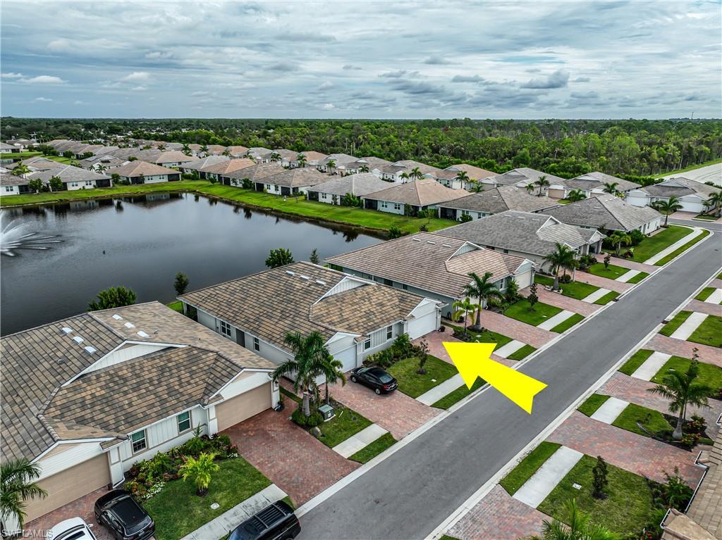 846 Enbrook Loop Naples, FL 34114 - Photo 37 of 45 an aerial view of a house with a lake view
