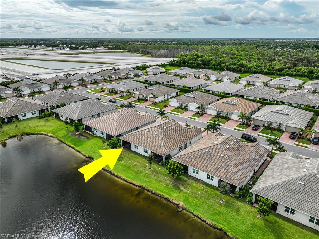 846 Enbrook Loop Naples, FL 34114 - Photo 39 of 45 an aerial view of a house with a swimming pool outdoor seating and yard