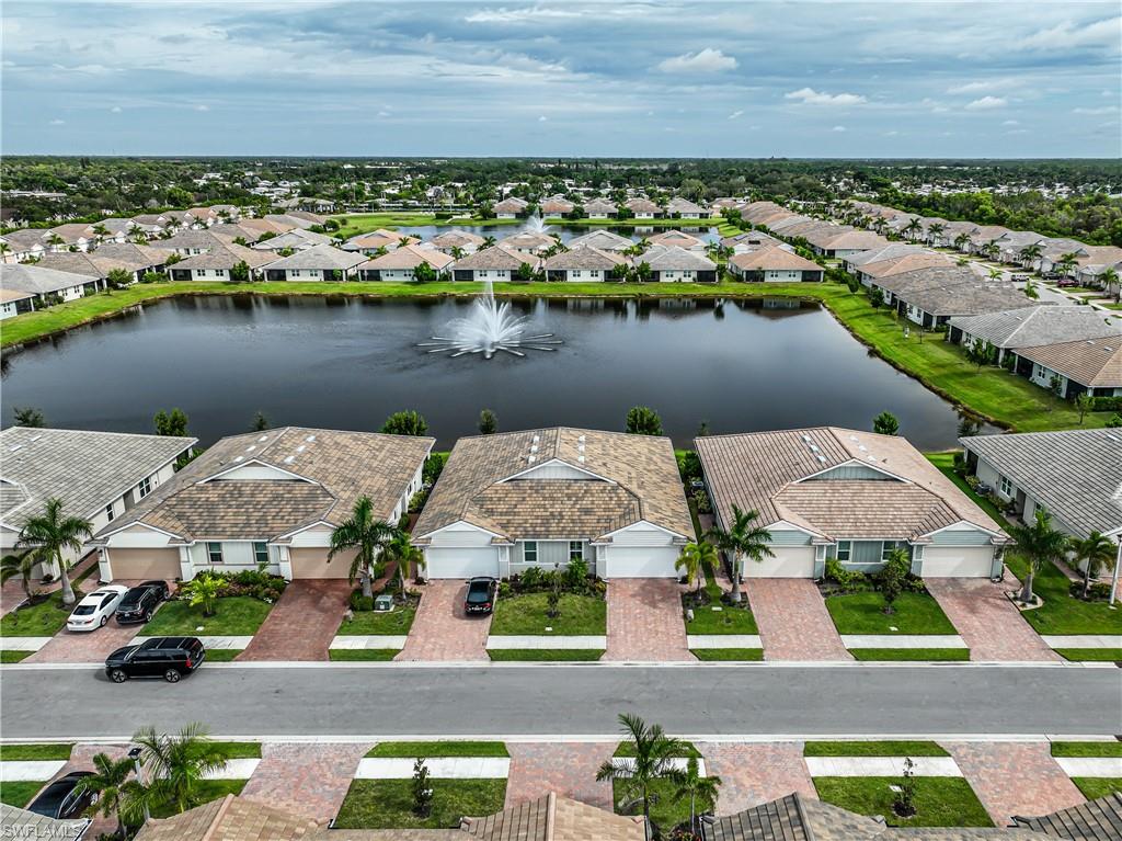 846 Enbrook Loop Naples, FL 34114 - Photo 40 of 45 an aerial view of multiple house with lake view