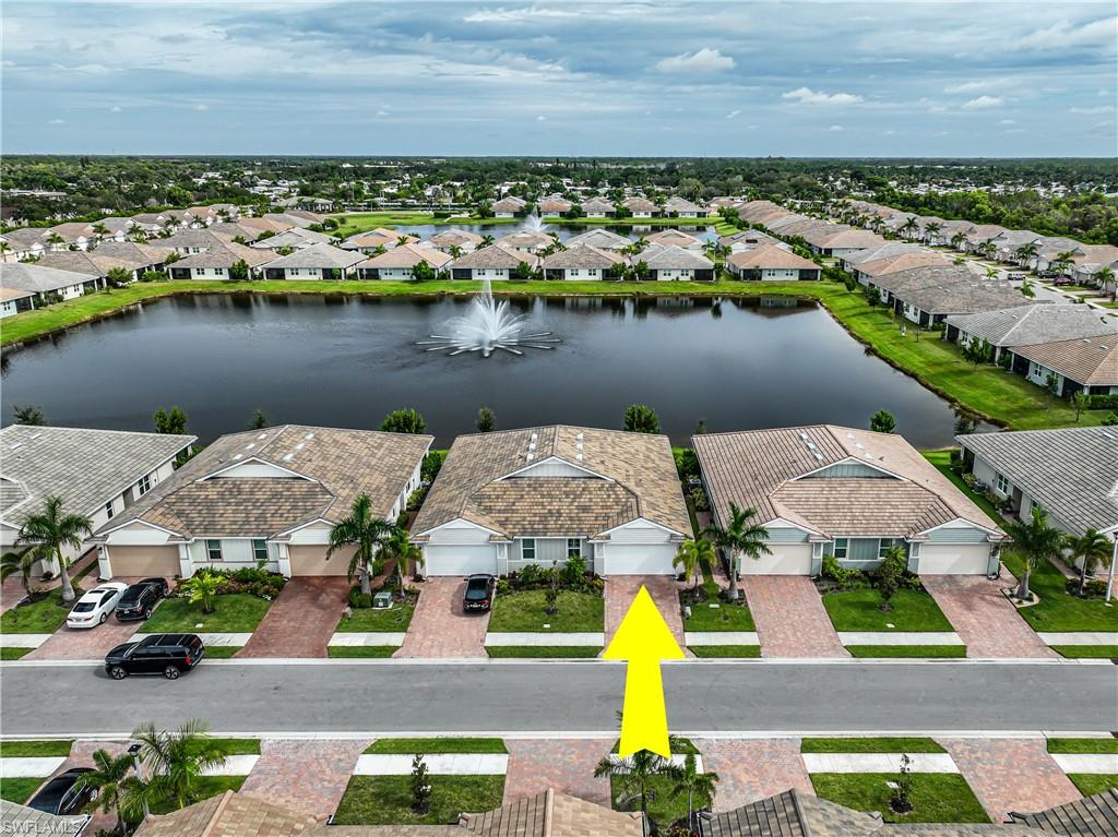 846 Enbrook Loop Naples, FL 34114 - Photo 41 of 45 an aerial view of a house with a lake view