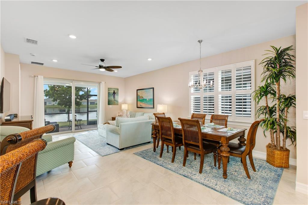 846 Enbrook Loop Naples, FL 34114 - Photo 5 of 45 a dining room with furniture window and wooden floor