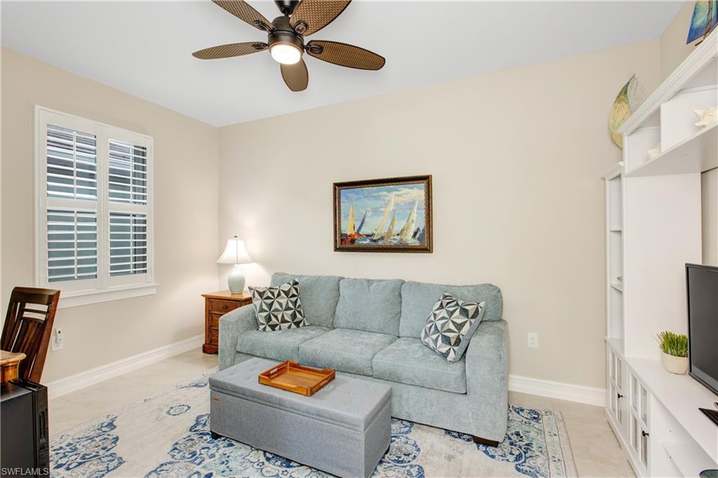 846 Enbrook Loop Naples, FL 34114 - Photo 8 of 45 a living room with furniture and a window