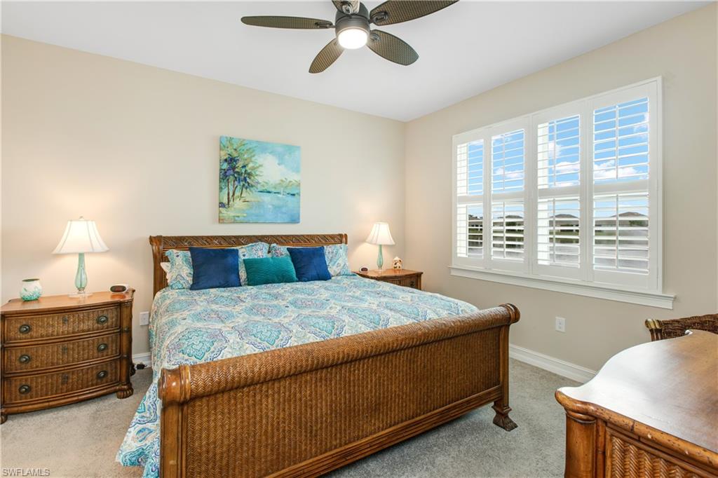 846 Enbrook Loop Naples, FL 34114 - Photo 9 of 45 a bedroom with a bed and a window
