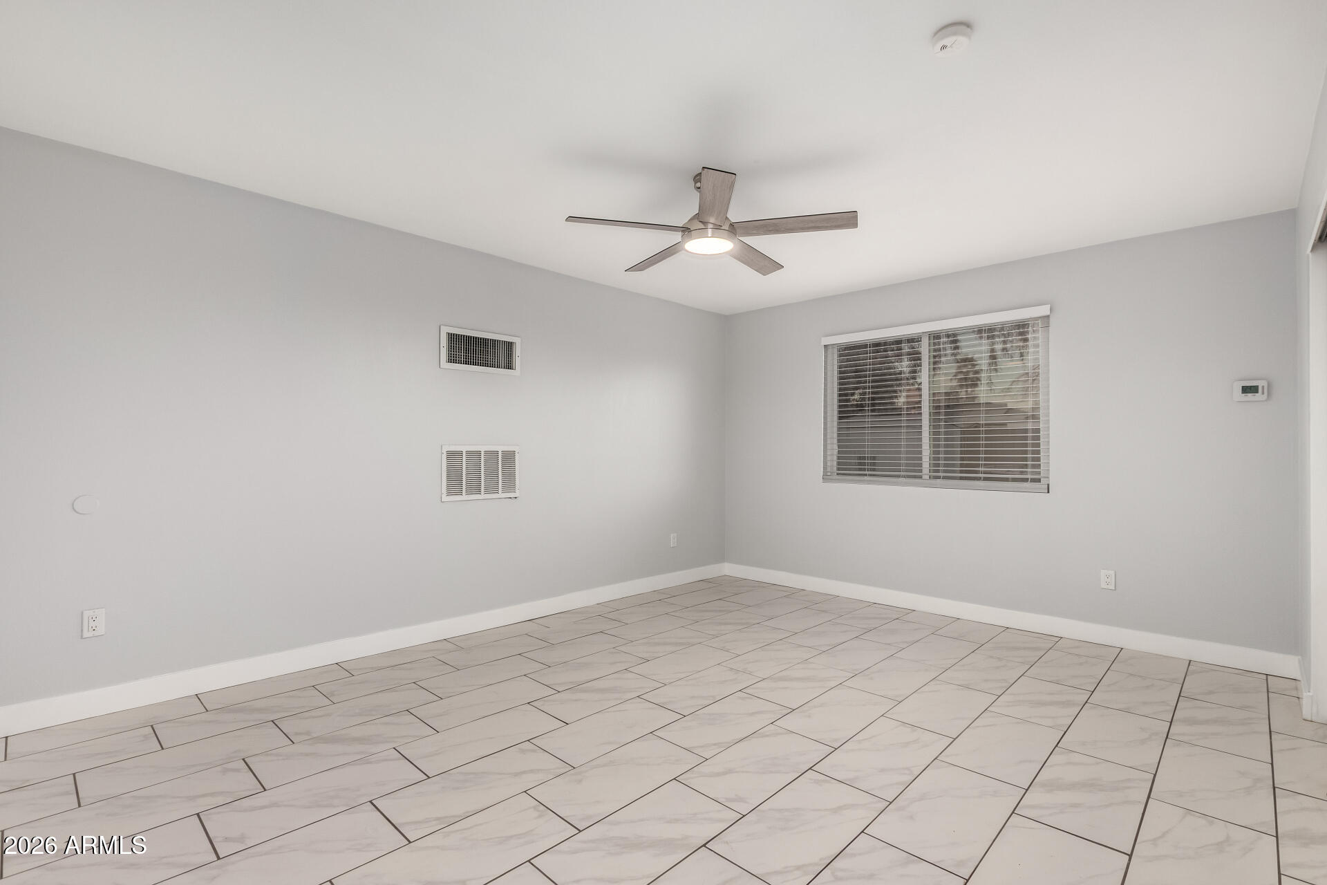 4938 West McLellan Road Glendale, AZ 85301 - Photo 11 of 22 a view of an empty room with a window