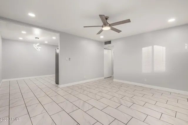 a view of an empty room and window