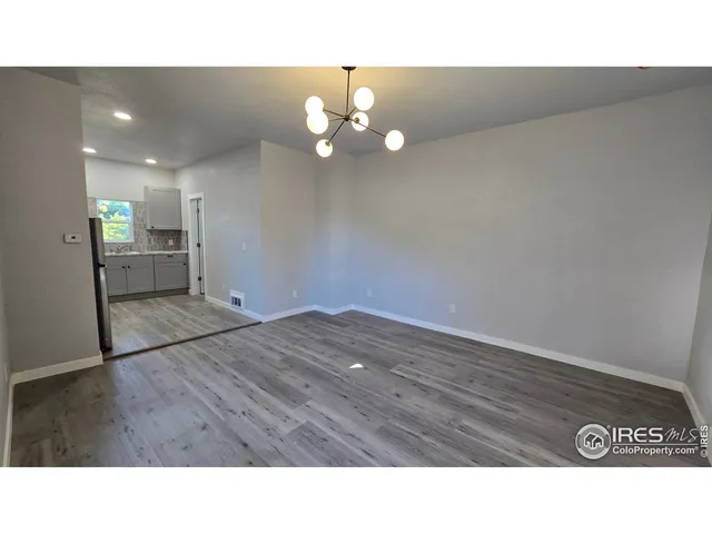 a kitchen with a wooden floor