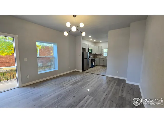 a kitchen with appliances cabinets and a sink