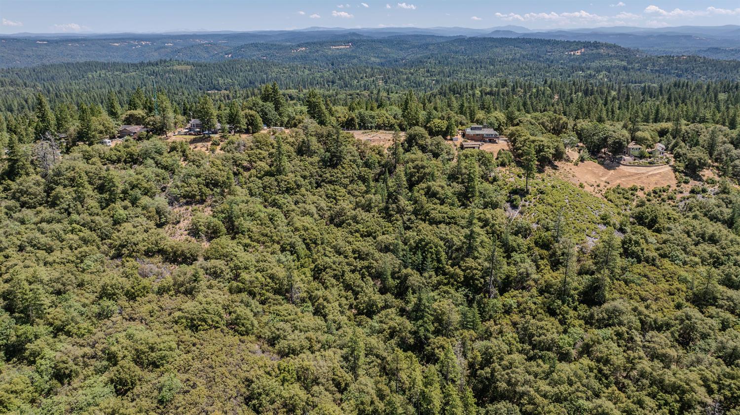 20117 Neilson Road Pine Grove, CA 95665 - Photo 20 of 32 a view of a city with lush green forest