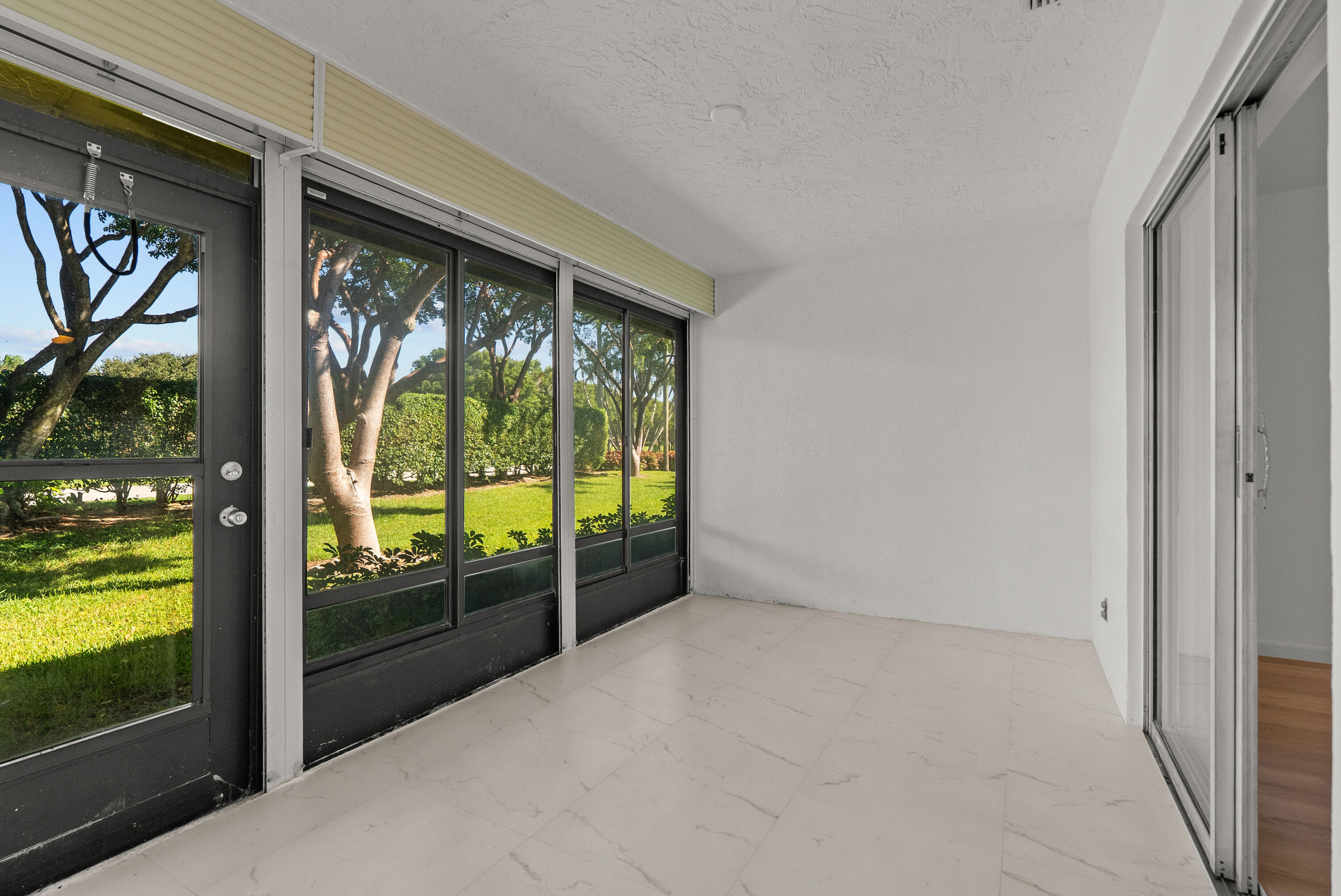 8273 Springtree Road Boca Raton, FL 33496 - Photo 27 of 35 a view of an empty room and window