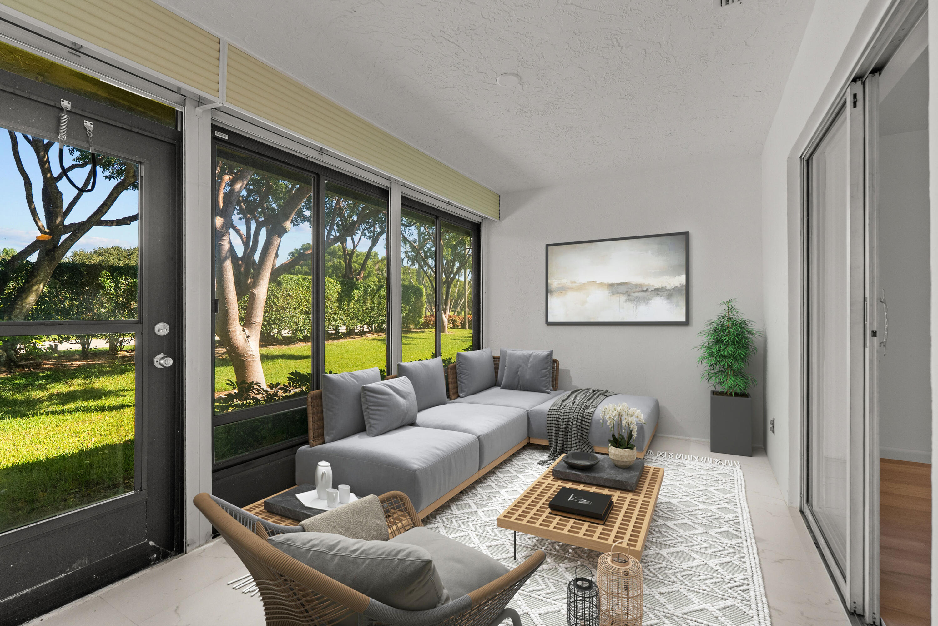 8273 Springtree Road Boca Raton, FL 33496 - Photo 7 of 35 a living room with furniture and a floor to ceiling window