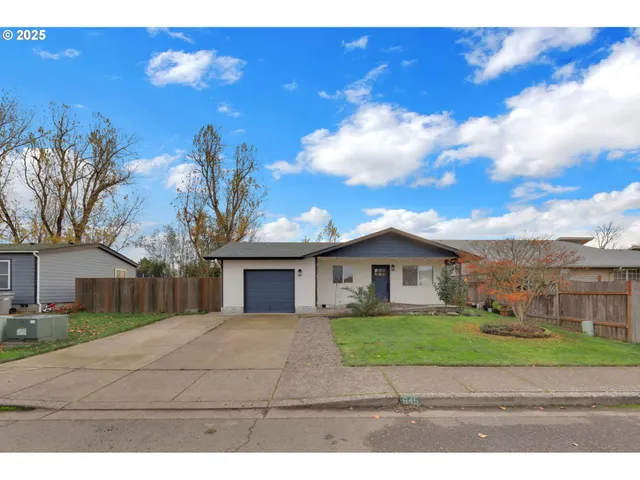 a view of house in front of house with yard