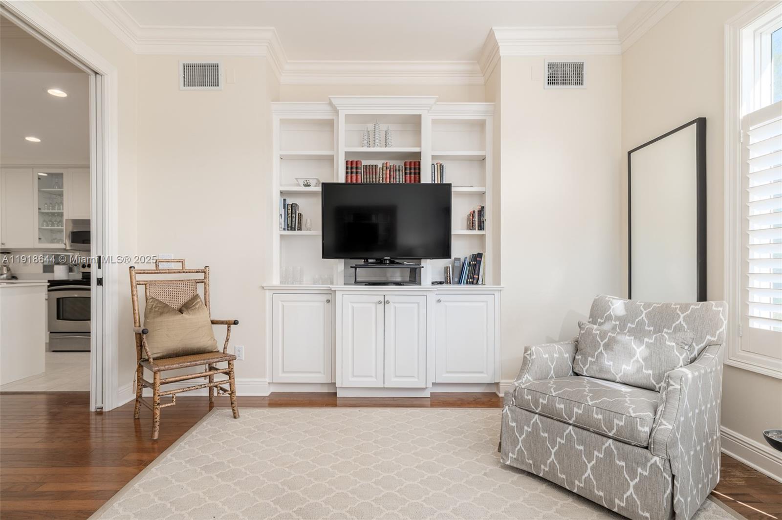 11609 Southeast Florida Avenue Hobe Sound, FL 33455 - Photo 15 of 31 a living room with furniture and a flat screen tv