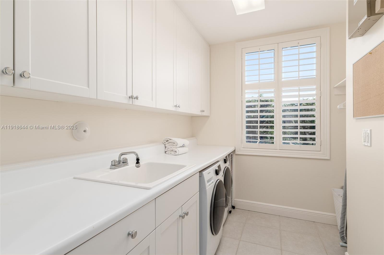 11609 Southeast Florida Avenue Hobe Sound, FL 33455 - Photo 18 of 31 a utility room with a window