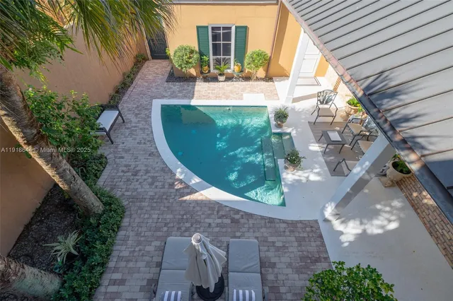 a view of a backyard with potted plants