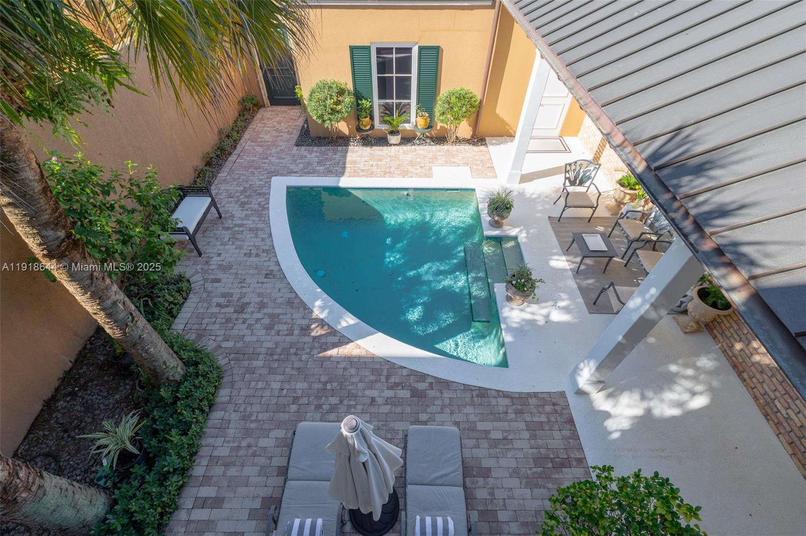 11609 Southeast Florida Avenue Hobe Sound, FL 33455 - Photo 21 of 31 a view of a backyard with potted plants